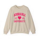 Beige crewneck sweatshirt with 'ADORABLE UNIVERSITY EST 2023' printed in pink on the front.