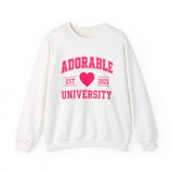 White crewneck sweatshirt with 'ADORABLE UNIVERSITY EST 2023' printed in pink on the front.