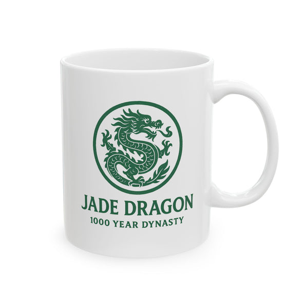 White mug with green dragon design and text on a white background