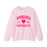 Light pink crewneck sweatshirt with 'ADORABLE UNIVERSITY EST 2023' printed in pink on the front.