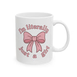 White mug with pink bow and text on a white background