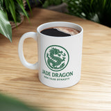 White mug with 'Jade Dragon' logo on a wooden table