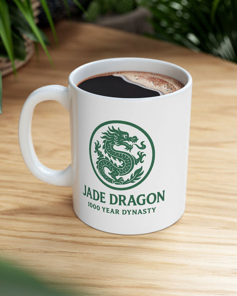 White mug with 'Jade Dragon' logo on a wooden table
