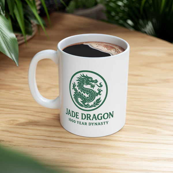 White mug with 'Jade Dragon' logo on a wooden table