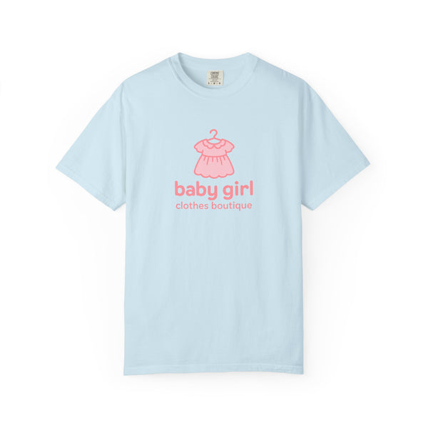 Light blue t-shirt with pink dress graphic and 'baby girl clothes boutique' text on a white background