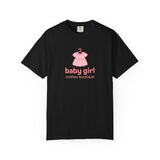 Black t-shirt with pink baby dress graphic and text on a white background