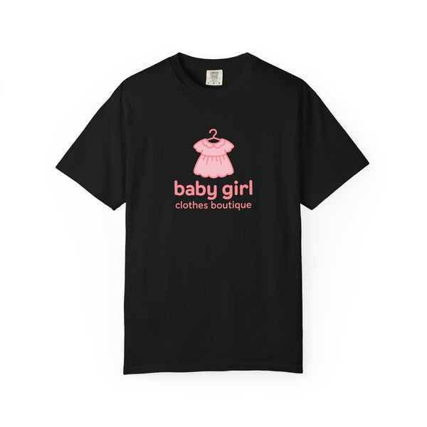 Black t-shirt with pink baby dress graphic and text on a white background