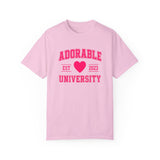 Pink crew neck t-shirt with the text 'ADORABLE UNIVERSITY EST 2023' printed in red, heart symbol replacing the year.
