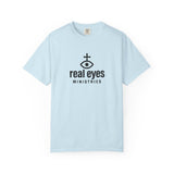 Light blue t-shirt with 'real eyes ministries' logo on a white background