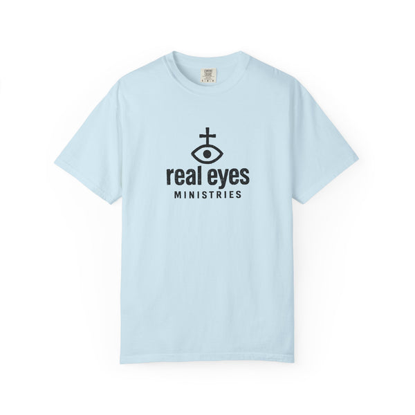 Light blue t-shirt with 'real eyes ministries' logo on a white background