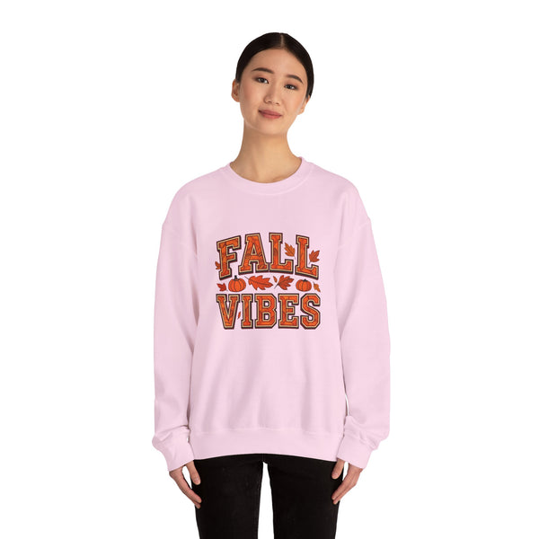 Person wearing a pink sweatshirt with 'Fall Vibes' text on a white background