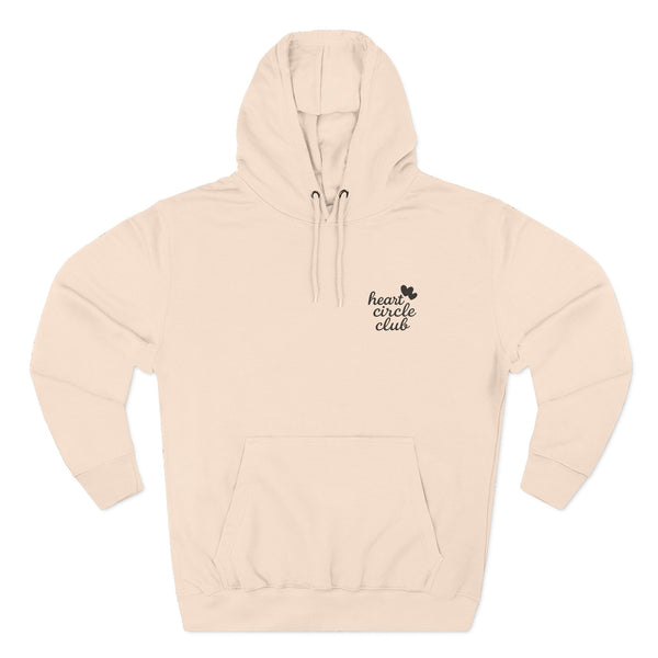 Beige hoodie with 'heart circle club' text on a white background