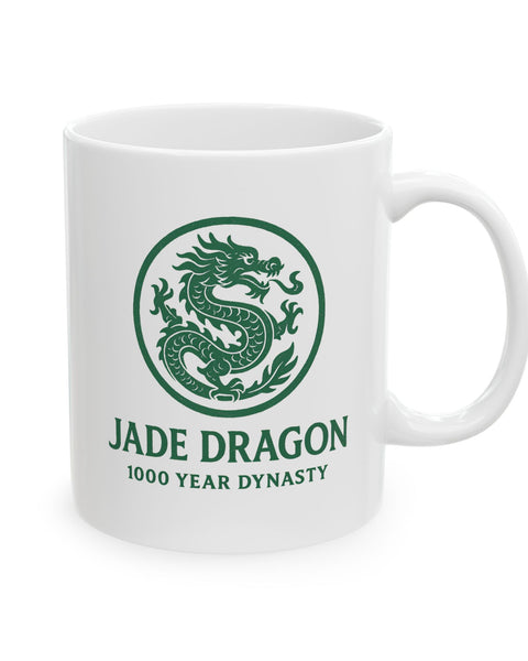 White mug with green dragon design and text on a white background