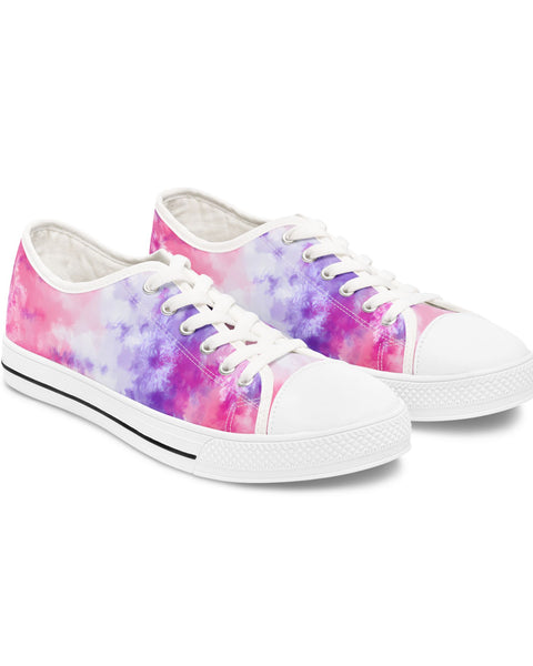 Pair of tie-dye sneakers with white laces on a white background