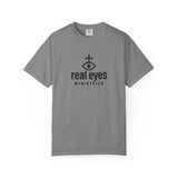 Gray t-shirt with 'real eyes ministries' logo on a white background