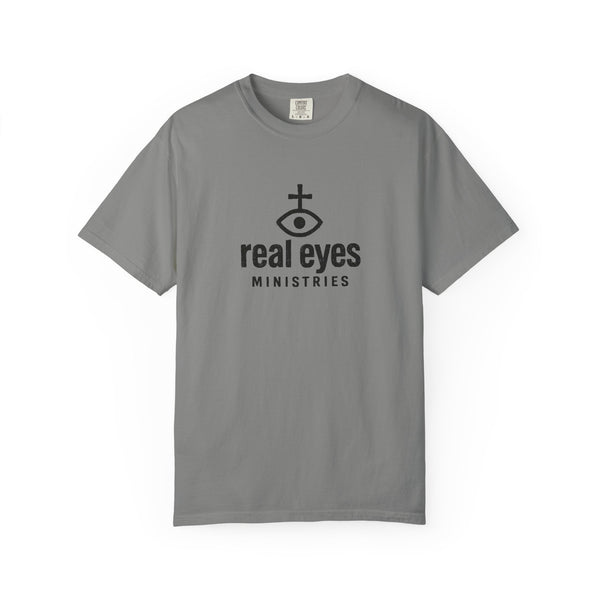 Gray t-shirt with 'real eyes ministries' logo on a white background