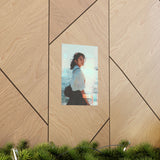 poster of a japanese schoolgirl smiling with a sparkling sea background placed on geometric wall