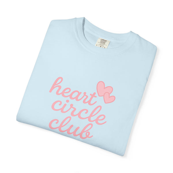 Light blue t-shirt with 'heart circle club' text and pink heart design on a white background
