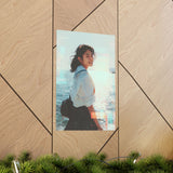 poster of a japanese schoolgirl smiling with a sparkling sea background placed on geometric wall