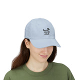 Person wearing a light blue cap with 'heart circle club' text on a white background
