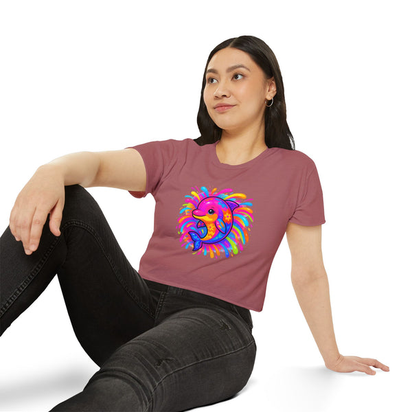 Person wearing a maroon t-shirt with a colorful dolphin design on a white background