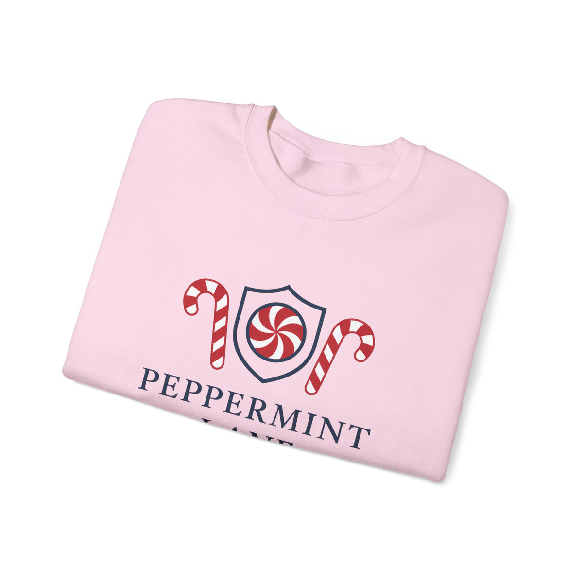 Folded pink sweatshirt with peppermint-themed design on a white background