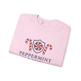 Folded pink sweatshirt with peppermint-themed design on a white background