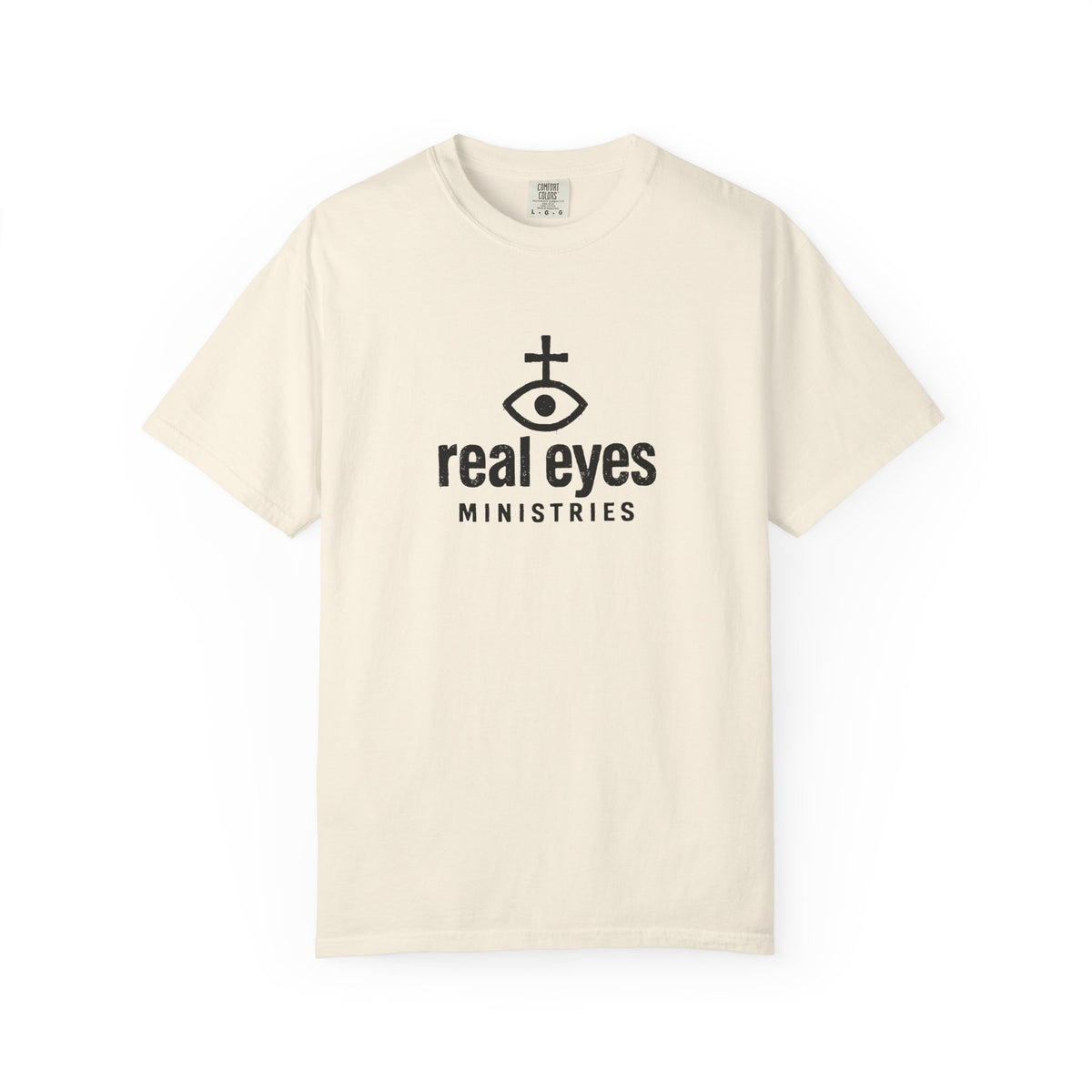 Beige t-shirt with 'real eyes ministries' logo on a white background