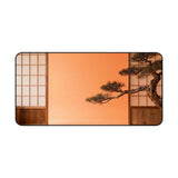 Desk mat with a surreal landscape with a bonsai tree against an orange sky and Japanese wooden panels.
