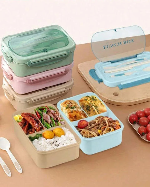 Set of colorful bento boxes with food compartments on a wooden surface.