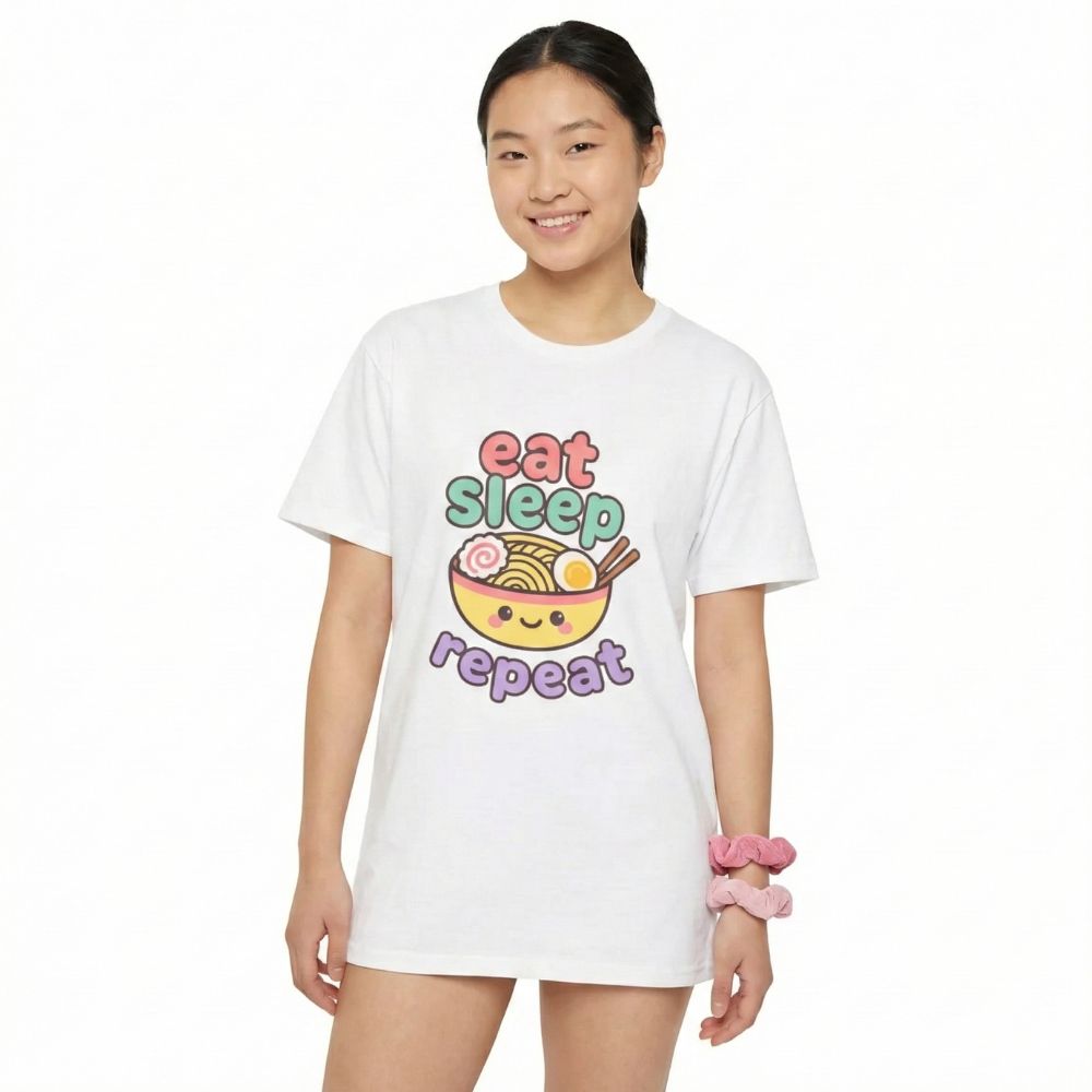 woman wearing a white t-shirt with a colorful graphic design with "Eat, Sleep, Repeat" on a white background
