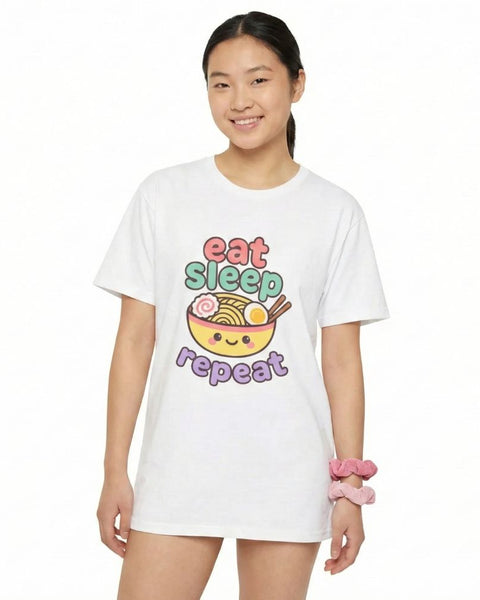 woman wearing a white t-shirt with a colorful graphic design with "Eat, Sleep, Repeat" on a white background