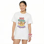 woman wearing a white t-shirt with a colorful graphic design with "Eat, Sleep, Repeat" on a white background