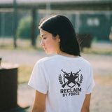 Person wearing a white t-shirt with a military design and 