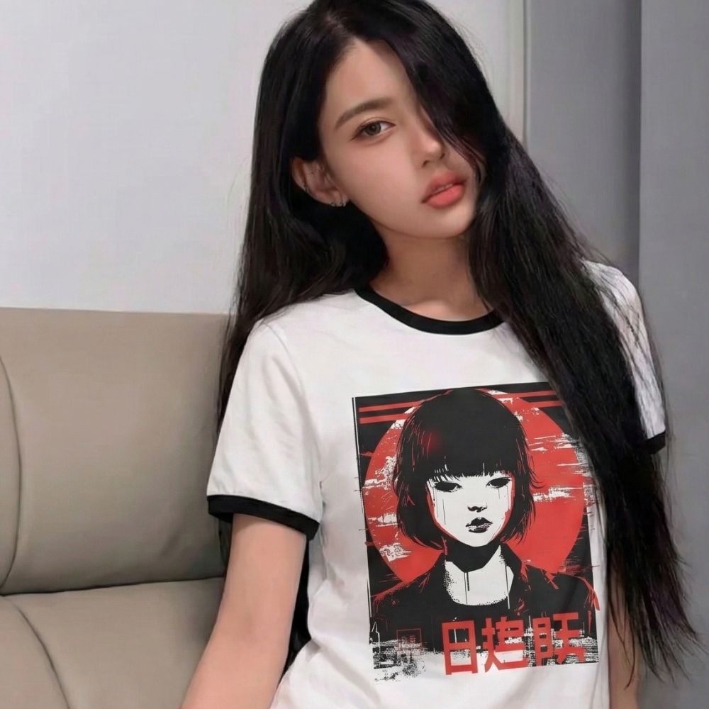 woman wearing a white t-shirt with a retro anime design of a woman with red hair and black clothing.