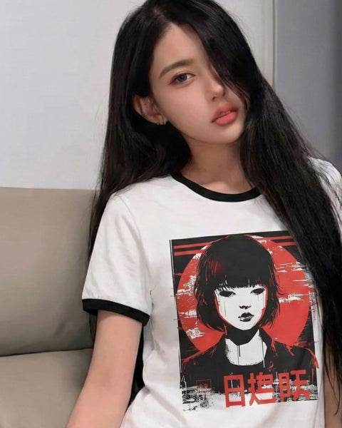 woman wearing a white t-shirt with a retro anime design of a woman with red hair and black clothing.