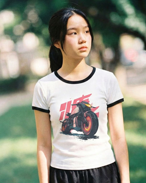 Asian girl wearing a vintage anime t-shirt with a motorcycle graphic outdoors